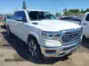 2020 Ram 1500 Longhorn with VIN 1C6SRFKM9LN229373, listed as a IAAI auction lot 42246047 with 134,671 mi miles and . Bid and sale history available at DreamBid. Image 1.