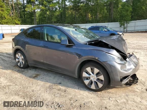 2023 Tesla Model Y Long Range with VIN 7SAYGAEE4PF668889, listed as a Copart auction lot 67239314 with 26,874 mi miles and Salvage title. Bid and sale history available at DreamBid. Image 4.