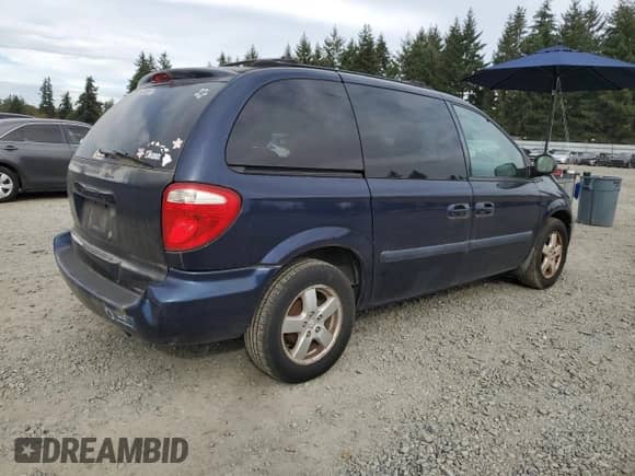 2005 Dodge Caravan SXT with VIN 1D4GP45RX5B127054, listed as a Copart auction lot 82190365 with 243,462 mi miles and Clean title. Bid and sale history available at DreamBid. Image 3.