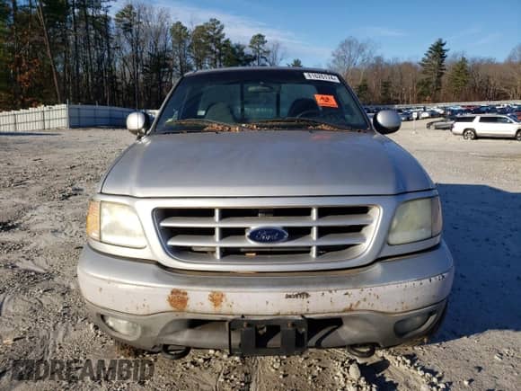 2002 Ford F-150 XL z VIN 1FTRF18212NA49764, wystawiony jako Copart lot #81626174 z przebiegiem Nie podano mil oraz Czysty tytuł • Clean title. Historia ofert i sprzedaży dostępna na DreamBid. Obrazek 5.