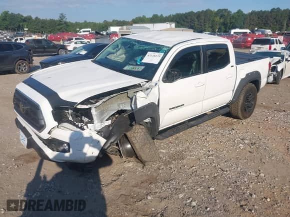 2021 Toyota Tacoma SR5 with VIN 3TMAZ5CN8MM152710, listed as a IAAI auction lot 43148239 with 40,000 mi miles and . Bid and sale history available at DreamBid. Image 2.