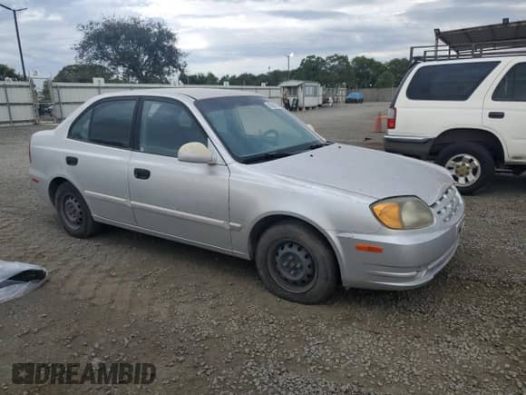 2005 Hyundai Accent GLS z VIN KMHCG45C25U604342, wystawiony jako Copart lot #85380125 z przebiegiem 165 690 mil mil oraz Czysty tytuł • Clean title. Historia ofert i sprzedaży dostępna na DreamBid. Obrazek 4.