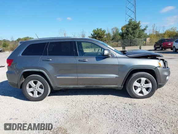 2011 Jeep Grand Cherokee Laredo z VIN 1J4RR4GG3BC723439, wystawiony jako IAAI lot #43385250 z przebiegiem 119 619 mil mil oraz . Historia ofert i sprzedaży dostępna na DreamBid. Obrazek 13.