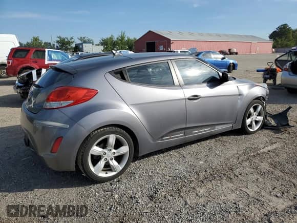 2012 Hyundai Veloster w/Black Int z VIN KMHTC6AD1CU081088, wystawiony jako Copart lot #71685565 z przebiegiem Nie podano mil oraz Szkoda całkowita • Salvage title. Historia ofert i sprzedaży dostępna na DreamBid. Obrazek 3.