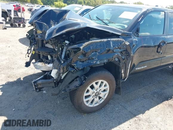 2024 Toyota Tacoma SR5 with VIN 3TMLB5JN7RM077957, listed as a IAAI auction lot 43149381 with 11,806 mi miles and . Bid and sale history available at DreamBid. Image 6.