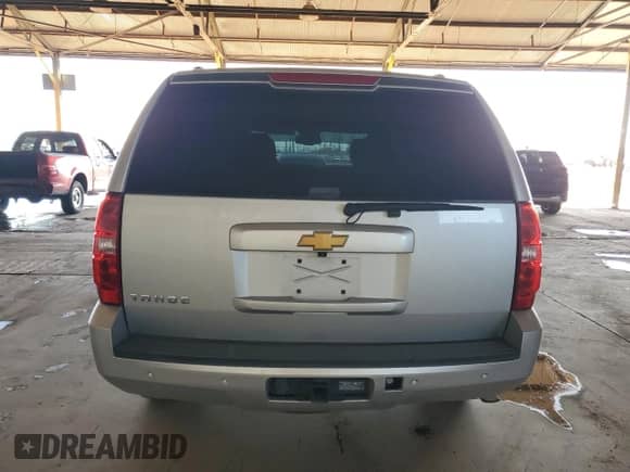 2014 Chevrolet Tahoe LT with VIN 1GNSCBE03ER110720, listed as a Copart auction lot 82323585 with 137,588 mi miles and Salvage title. Bid and sale history available at DreamBid. Image 6.