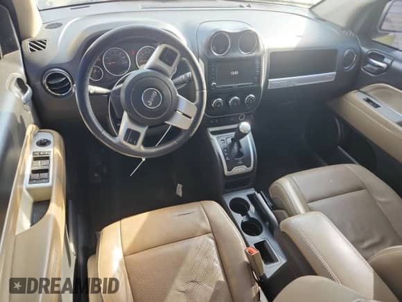 2016 Jeep Compass Latitude with VIN 1C4NJCEA7GD777378, listed as a Copart auction lot 56390385 with 123,186 mi miles and Salvage title. Bid and sale history available at DreamBid. Image 8.