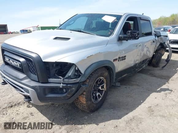 2015 Ram 1500 Rebel with VIN 1C6RR7YT0FS751334, listed as a IAAI auction lot 41933040 with 167,336 mi miles and . Bid and sale history available at DreamBid. Image 2.