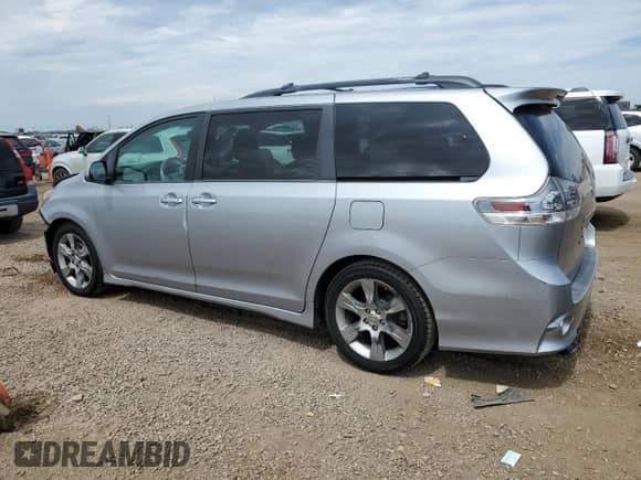 2014 Toyota Sienna SE with VIN 5TDXK3DC0ES412437, listed as a Copart auction lot 70558525 with 145,488 mi miles and Salvage title. Bid and sale history available at DreamBid. Image 2.