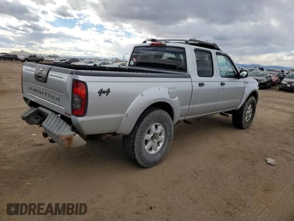 2003 Nissan Frontier SVE with VIN 1N6MD29Y83C457312, listed as a Copart auction lot 79390474 with 119,904 mi miles and Salvage title. Bid and sale history available at DreamBid. Image 3.