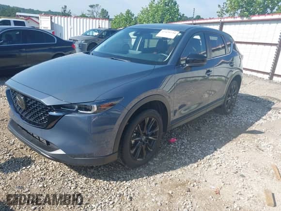 2023 Mazda CX-5 S Carbon Edition z VIN JM3KFBCM9P0211734, wystawiony jako IAAI lot #42439734 z przebiegiem 22 886 mil mil oraz . Historia ofert i sprzedaży dostępna na DreamBid. Obrazek 17.