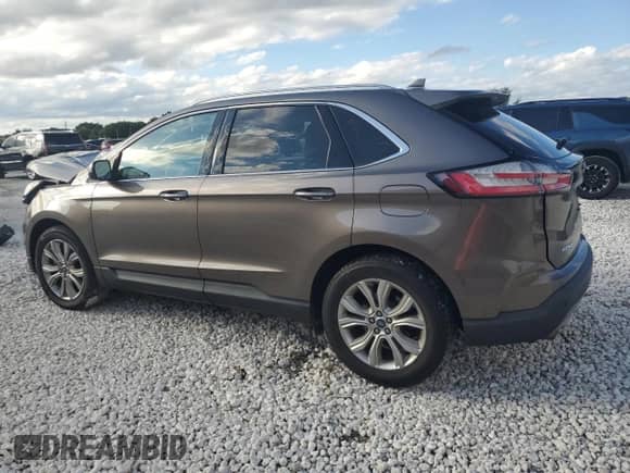 2019 Ford Edge Titanium with VIN 2FMPK3K92KBB23222, listed as a Copart auction lot 86527245 with 64,990 mi miles and Salvage title. Bid and sale history available at DreamBid. Image 2.