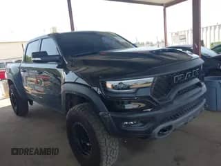 2022 Ram 1500 TRX with VIN 1C6SRFU90NN369047, listed as a IAAI auction lot 42562232 with 14,501 mi miles and . Bid and sale history available at DreamBid. Image 1.