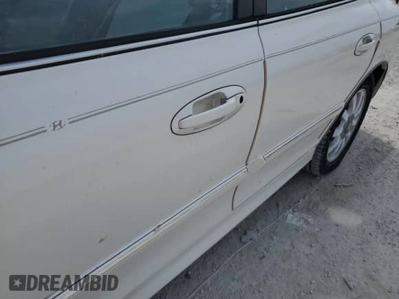 2003 Hyundai Sonata GLS z VIN KMHWF35H83A876608, wystawiony jako Copart lot #78296724 z przebiegiem Nie podano mil oraz Nie do naprawy • Non repairable. Historia ofert i sprzedaży dostępna na DreamBid. Obrazek 12.