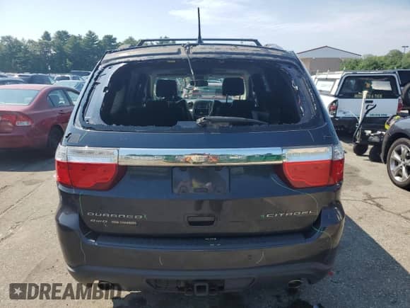 2013 Dodge Durango Citadel with VIN 1C4SDJET9DC679034, listed as a Copart auction lot 65875115 with 121,604 mi miles and Salvage title. Bid and sale history available at DreamBid. Image 6.
