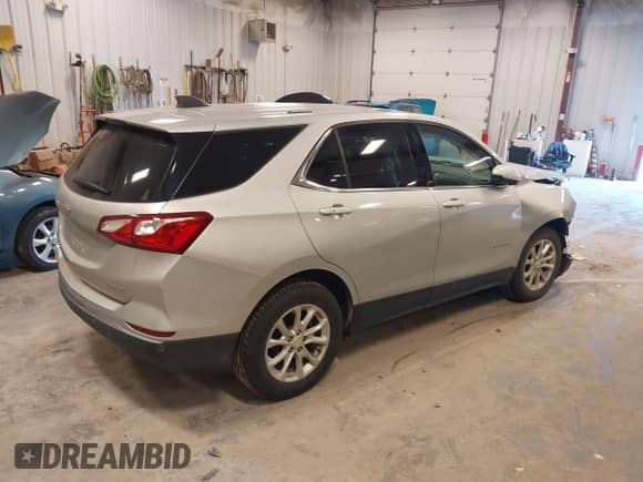 2018 Chevrolet Equinox LT z VIN 2GNAXSEVXJ6352812, wystawiony jako IAAI lot #43168373 z przebiegiem 128 214 mil mil oraz . Historia ofert i sprzedaży dostępna na DreamBid. Obrazek 4.