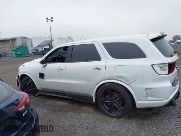 2021 Dodge Durango SRT 392 with VIN 1C4SDJGJ4MC696660, listed as a IAAI auction lot 42419277 with 30,521 mi miles and . Bid and sale history available at DreamBid. Image 14.
