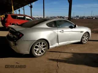 2007 Hyundai Tiburon GT с VIN KMHHN66F57U242154, выставлен на аукционе Copart как лот 85104284 с пробегом 122 242 миль миль и Чистый • Clean title. История ставок и продаж доступна на DreamBid. Изображение 3.