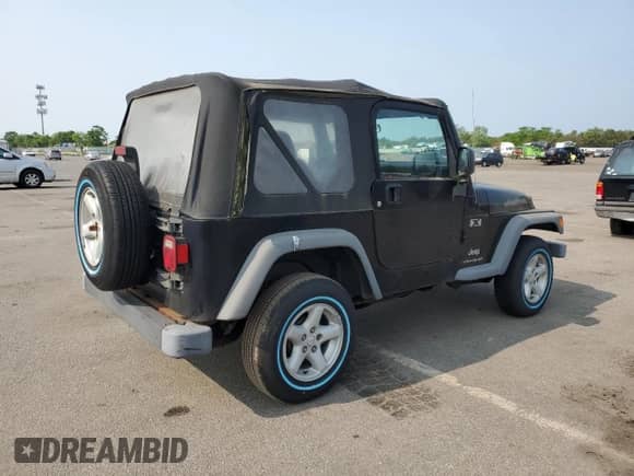 2003 Jeep Wrangler X z VIN 1J4FA39S23P359983, wystawiony jako Copart lot #59469005 z przebiegiem 118 585 mil mil oraz Czysty tytuł • Clean title. Historia ofert i sprzedaży dostępna na DreamBid. Obrazek 3.