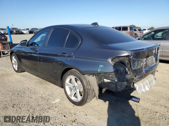 2014 BMW 3 Series 320i with VIN WBA3B1C56EP680339, listed as a Copart auction lot 82658825 with 76,283 mi miles and Salvage title. Bid and sale history available at DreamBid. Image 2.