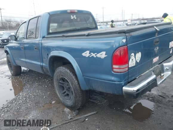 2003 Dodge Dakota SLT z VIN 1D7HG48N43S249020, wystawiony jako IAAI lot #41580449 z przebiegiem 240 500 mil mil oraz . Historia ofert i sprzedaży dostępna na DreamBid. Obrazek 3.