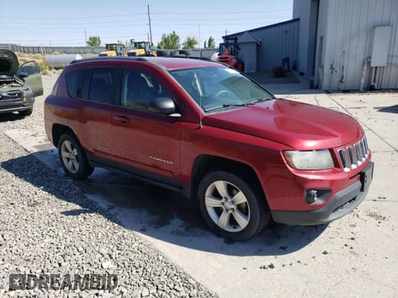 2014 Jeep Compass Sport with VIN 1C4NJDBB8ED567758, listed as a Copart auction lot 67984065 with 123,788 mi miles and Salvage title. Bid and sale history available at DreamBid. Image 4.