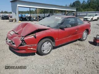 1996 Saturn SC with VIN 1G8ZF1281TZ216240, listed as a Copart auction lot 74964504 with 201,977 mi miles and Salvage title. Bid and sale history available at DreamBid. Image 1.