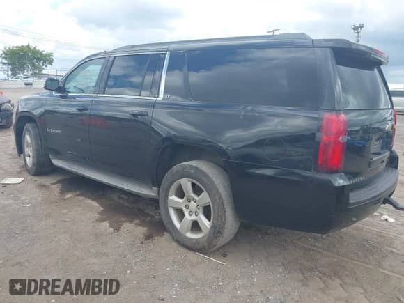 2015 Chevrolet Suburban LT with VIN 1GNSCJKC1FR545648, listed as a IAAI auction lot 42982512 with 405,947 mi miles and . Bid and sale history available at DreamBid. Image 3.