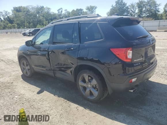 2021 Honda Passport Touring with VIN 5FNYF7H92MB004586, listed as a Copart auction lot 70409535 with 57,226 mi miles and Salvage title. Bid and sale history available at DreamBid. Image 2.