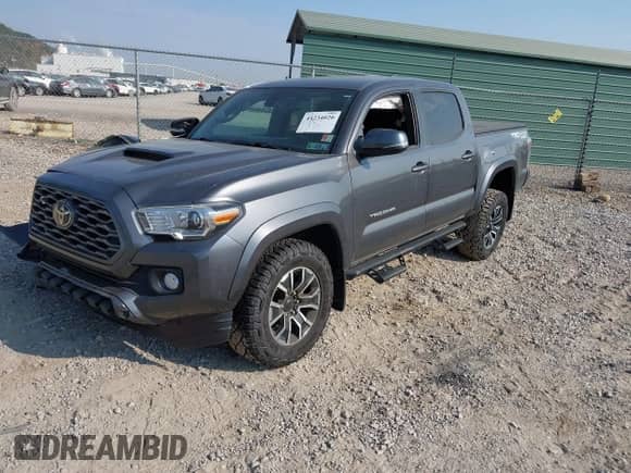 2021 Toyota Tacoma SR with VIN 3TYCZ5AN0MT027247, listed as a IAAI auction lot 43234020 with 26,058 mi miles and . Bid and sale history available at DreamBid. Image 2.