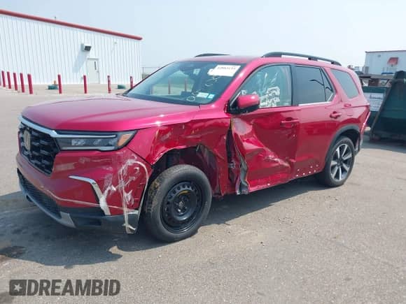 2023 Honda Pilot Elite with VIN 5FNYG1H83PB004800, listed as a IAAI auction lot 42883135 with 12,162 mi miles and . Bid and sale history available at DreamBid. Image 2.