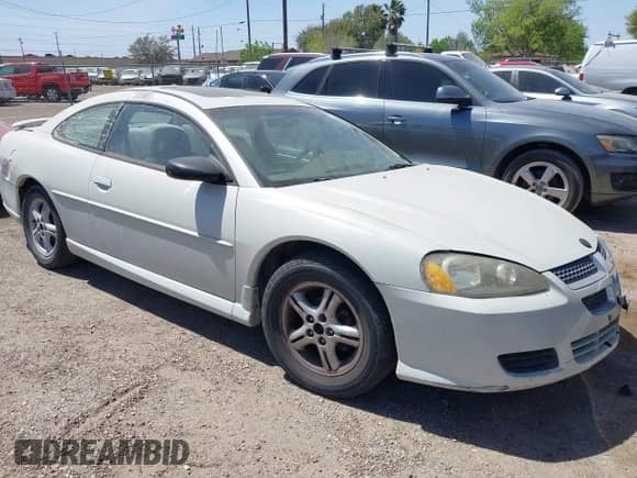 2003 Dodge Stratus SE z VIN 4B3AG42G23E128586, wystawiony jako IAAI lot #41697724 z przebiegiem 228 623 mil mil oraz . Historia ofert i sprzedaży dostępna na DreamBid. Obrazek 1.