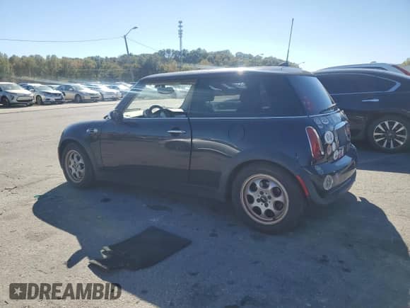 2005 MINI Hardtop with VIN WMWRC33425TC57990, listed as a Copart auction lot 86117205 with Not provided miles and Clean title. Bid and sale history available at DreamBid. Image 2.