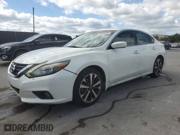 2016 Nissan Altima SR with VIN 1N4AL3AP2GC265512, listed as a Copart auction lot 84906895 with 196,243 mi miles and Salvage title. Bid and sale history available at DreamBid. Image 1.