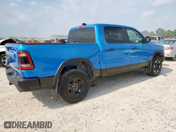 2024 Ram 1500 Rebel z VIN 1C6SRFLT2RN122227, wystawiony jako Copart lot #57086395 z przebiegiem 23 705 mil mil oraz Szkoda całkowita • Salvage title. Historia ofert i sprzedaży dostępna na DreamBid. Obrazek 3.