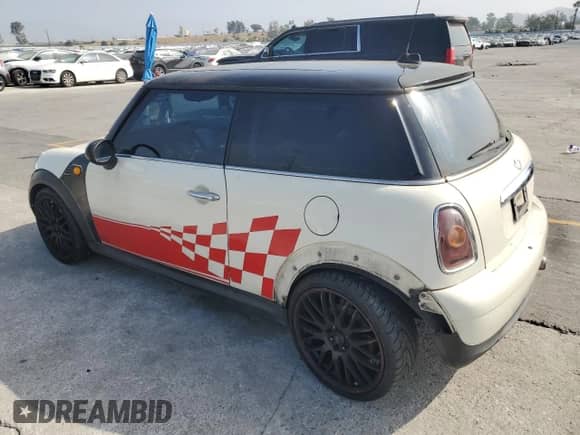 2007 MINI Hardtop with VIN WMWMF33547TT51590, listed as a Copart auction lot 57323995 with 114,113 mi miles and Salvage title. Bid and sale history available at DreamBid. Image 2.