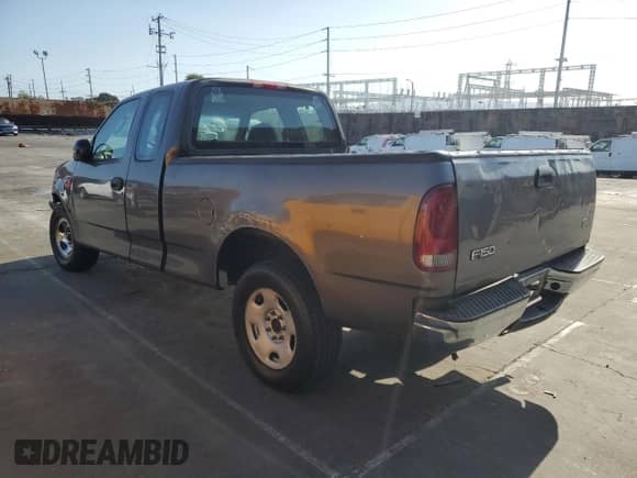 2003 Ford F-150 XL with VIN 1FTRX17223KB15935, listed as a Copart auction lot 70927245 with 167,265 mi miles and Salvage title. Bid and sale history available at DreamBid. Image 2.