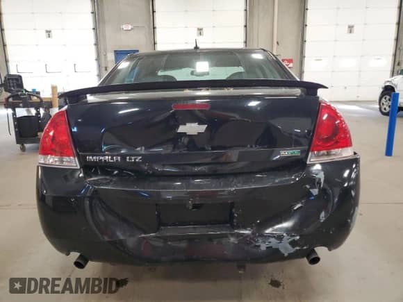 2013 Chevrolet Impala LTZ with VIN 2G1WC5E33D1155274, listed as a Copart auction lot 82623505 with 165,910 mi miles and Salvage title. Bid and sale history available at DreamBid. Image 6.
