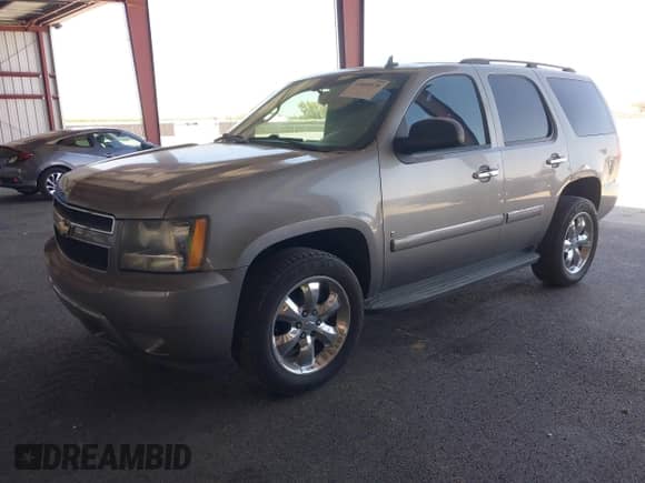 2009 Chevrolet Tahoe LS z VIN 1GNFC13029R219805, wystawiony jako IAAI lot #43089529 z przebiegiem 162 494 mil mil oraz . Historia ofert i sprzedaży dostępna na DreamBid. Obrazek 2.