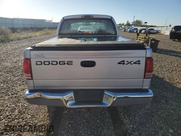 2002 Dodge Dakota SLT z VIN 1B7HG48N02S564941, wystawiony jako Copart lot #85174375 z przebiegiem 110 566 mil mil oraz Czysty tytuł • Clean title. Historia ofert i sprzedaży dostępna na DreamBid. Obrazek 6.