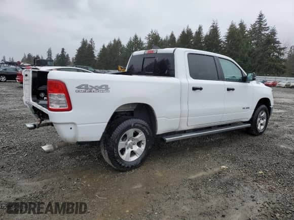 2023 Ram 1500 Big Horn with VIN 1C6SRFMT1PN547515, listed as a Copart auction lot 49818415 with 26,468 mi miles and Salvage title. Bid and sale history available at DreamBid. Image 3.