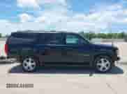 2013 Chevrolet Suburban LT with VIN 1GNSKJE71DR168382, listed as a IAAI auction lot 42821206 with 209,210 mi miles and . Bid and sale history available at DreamBid. Image 13.