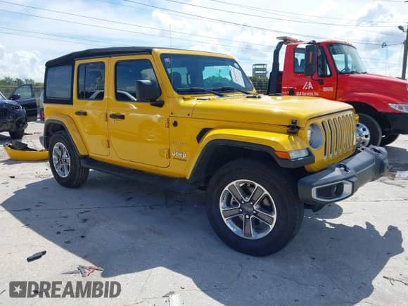 2021 Jeep Wrangler Unlimited Sahara Altitude with VIN 1C4HJXEG8MW561709, listed as a IAAI auction lot 42955764 with 67,226 mi miles and . Bid and sale history available at DreamBid. Image 1.
