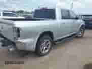 2014 Ram 1500 Laramie with VIN 1C6RR6NT0ES122640, listed as a IAAI auction lot 42638561 with 129,878 mi miles and . Bid and sale history available at DreamBid. Image 4.