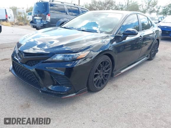 2023 Toyota Camry TRD with VIN 4T1KZ1AK7PU072266, listed as a IAAI auction lot 43208479 with 58,999 mi miles and . Bid and sale history available at DreamBid. Image 2.