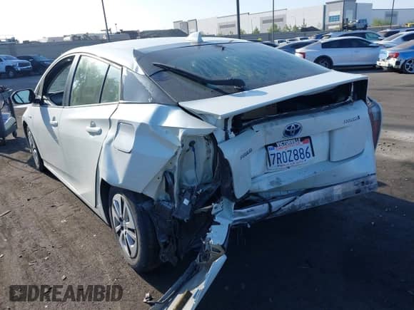 2016 Toyota Prius Four z VIN JTDKARFU7G3502954, wystawiony jako IAAI lot #42652179 z przebiegiem 219 669 mil mil oraz . Historia ofert i sprzedaży dostępna na DreamBid. Obrazek 3.