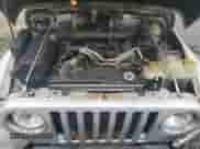 2004 Jeep Wrangler Sport z VIN 1J4FA49SX4P764853, wystawiony jako Copart lot #67621195 z przebiegiem 183 544 mil mil oraz Szkoda całkowita • Salvage title. Historia ofert i sprzedaży dostępna na DreamBid. Obrazek 11.