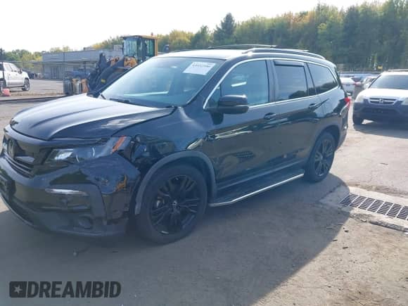 2021 Honda Pilot Special Edition with VIN 5FNYF6H22MB015925, listed as a IAAI auction lot 43332390 with 77,152 mi miles and . Bid and sale history available at DreamBid. Image 2.