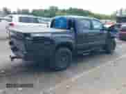 2023 Toyota Tacoma SR z VIN 3TMCZ5AN2PM585925, wystawiony jako IAAI lot #43009810 z przebiegiem 43 671 mil mil oraz . Historia ofert i sprzedaży dostępna na DreamBid. Obrazek 4.