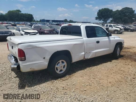 2000 Dodge Dakota с VIN 1B7GL22X1YS697058, выставлен на аукционе Copart как лот 63463645 с пробегом 246 206 миль миль и Списание • Salvage title. История ставок и продаж доступна на DreamBid. Изображение 3.